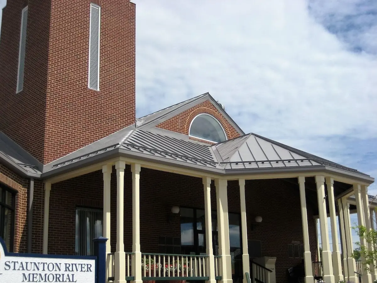 Skilled roofing craftsmen working on a residential roof in Brookings